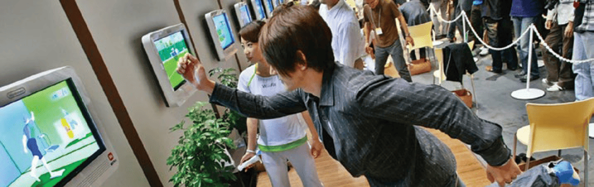 Participants at a tradeshow sample a spatial computing demonstration.