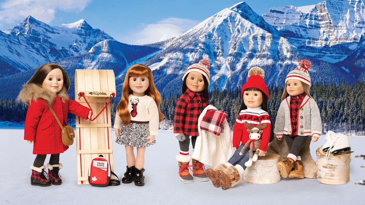 Maplelea Girl Canadiana-themed dolls posed against a backdrop of the Rockies.