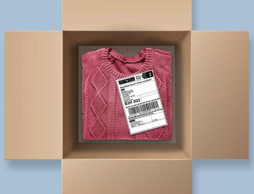 An open box contains a sweater and Expedited Parcel return shipping label.